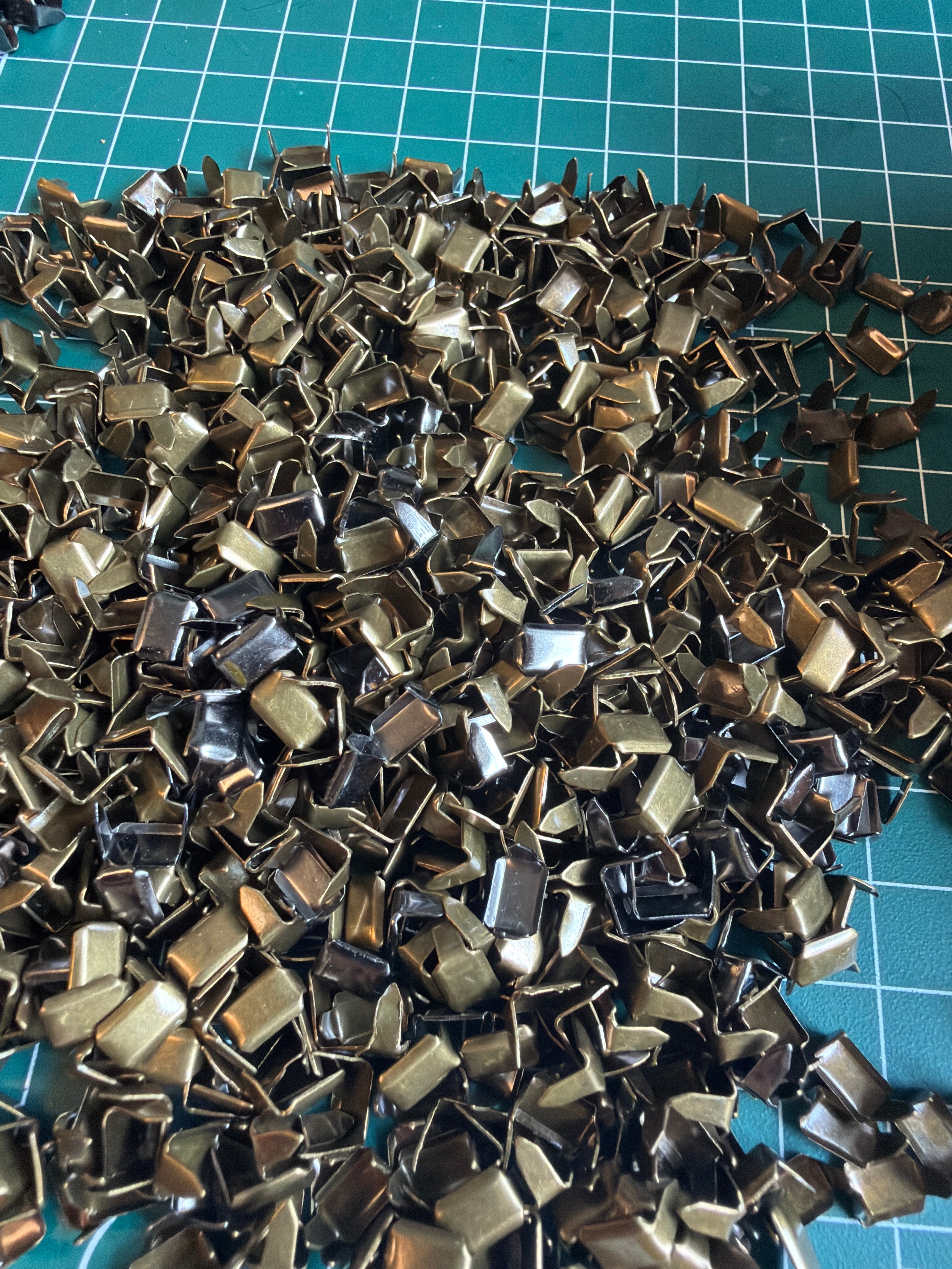 Metal staples for straps