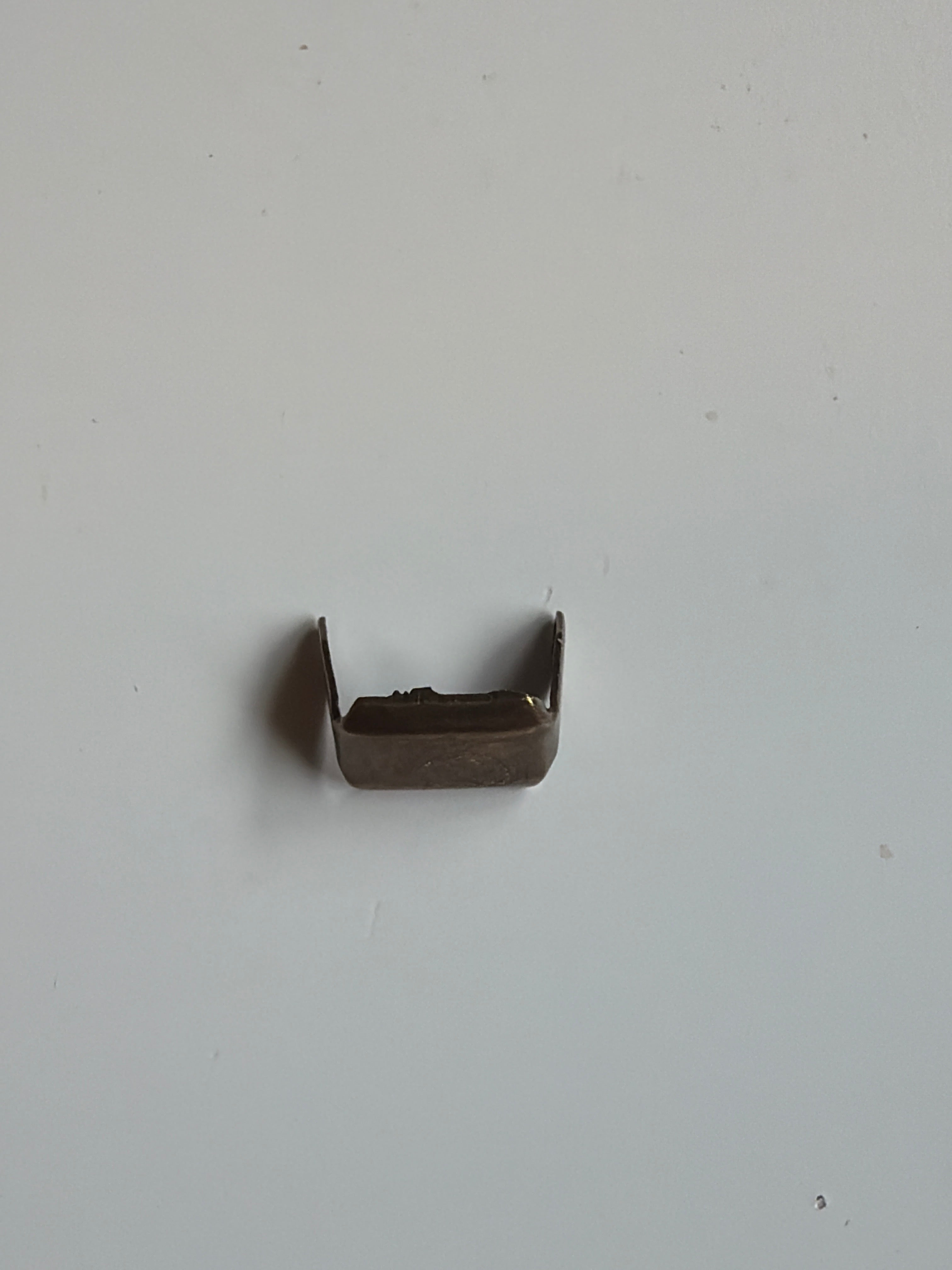 Metal staples for straps